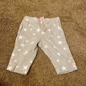 Baby clothes gray pants with white stars and pink buttons